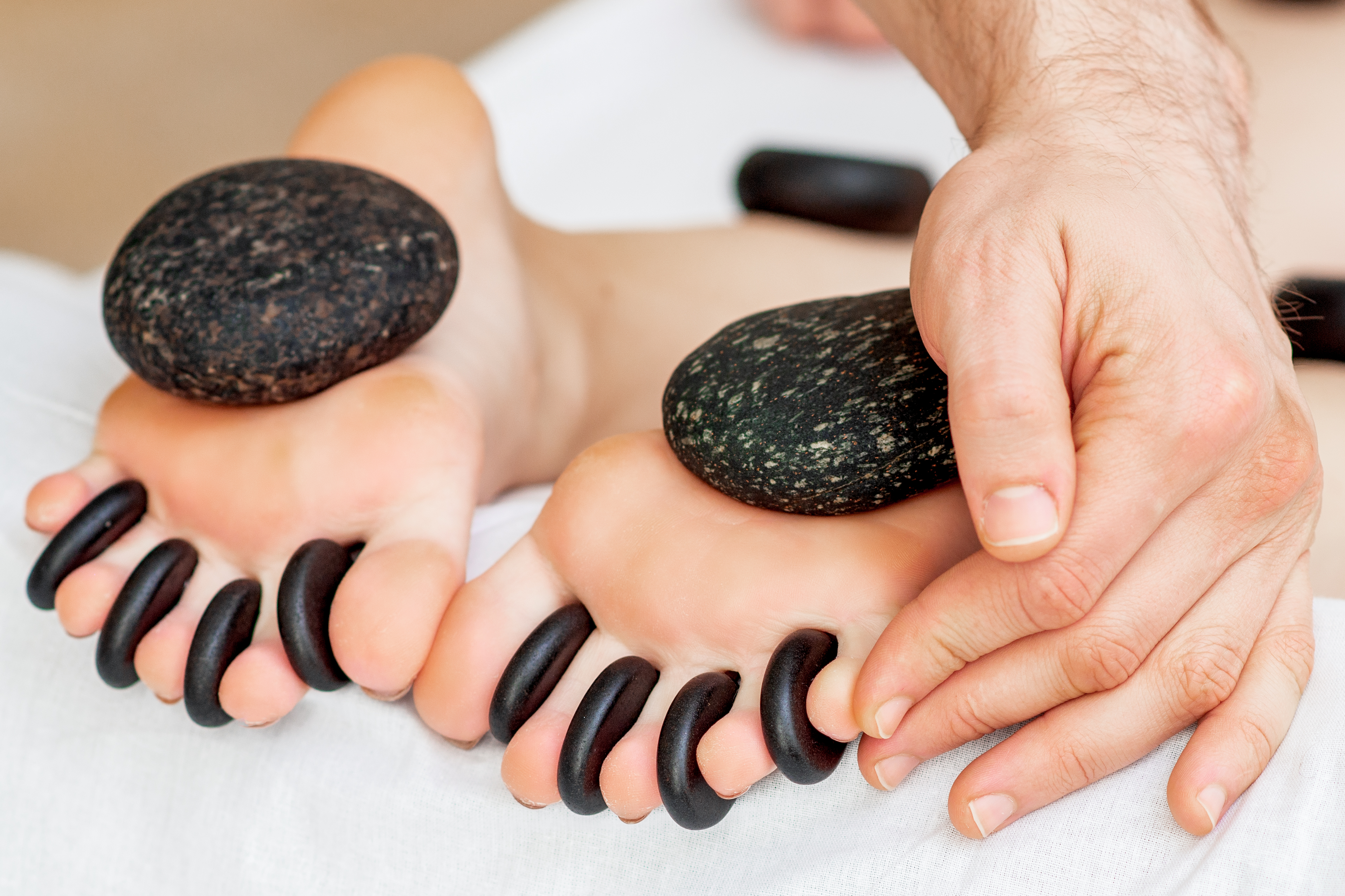Hot Stone vs. Deep Tissue Massage: Key Differences and Benefits Explained 